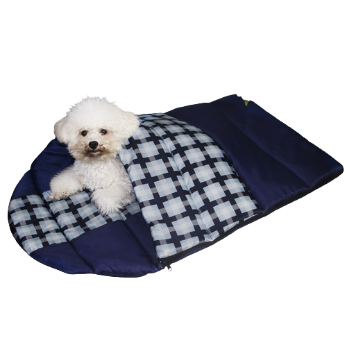 Cozy blue plaid dog sleeping bag laid out on camping trip, perfect for pet travel