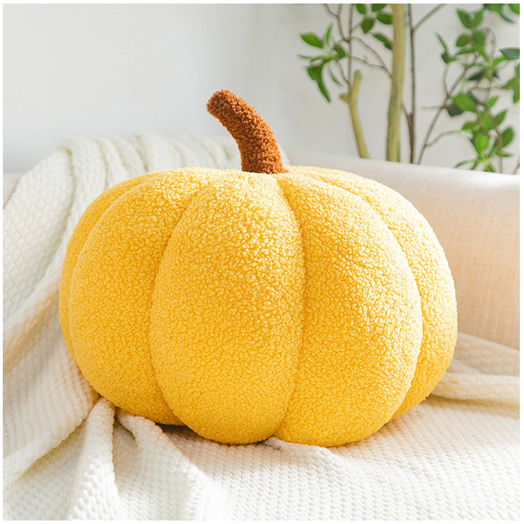 Close-up of soft pumpkin pillow fabric and design